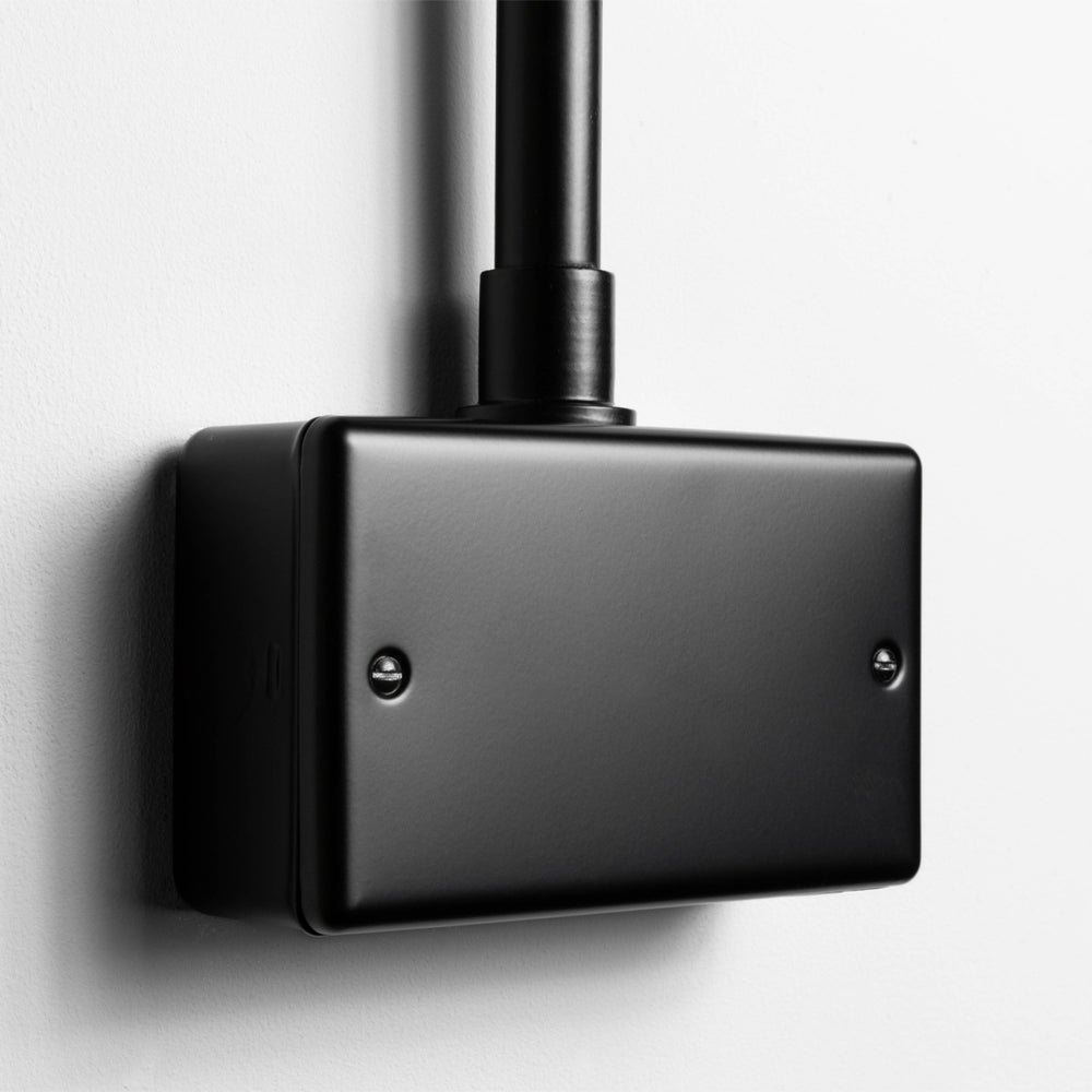 Matt Black Double Blank Plate With Back Box And Conduit On A Light Grey Background