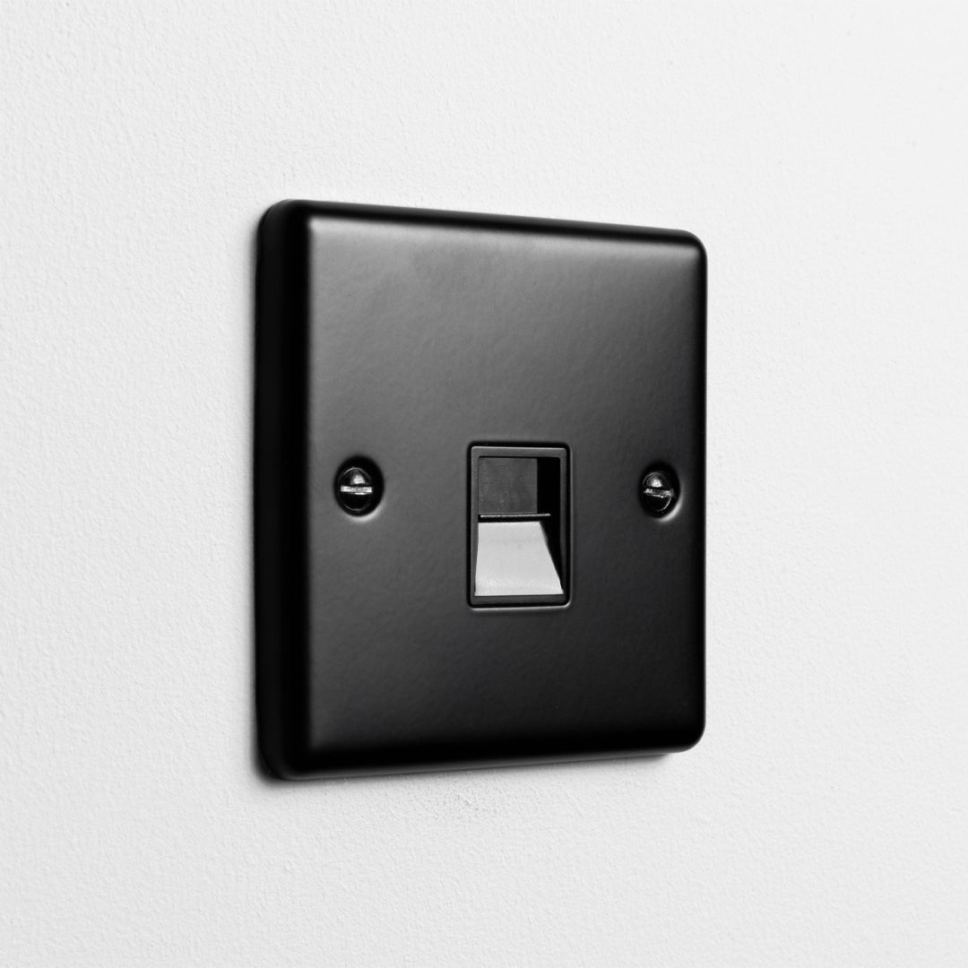 Matt Black Telephone Socket On A Light Grey Background