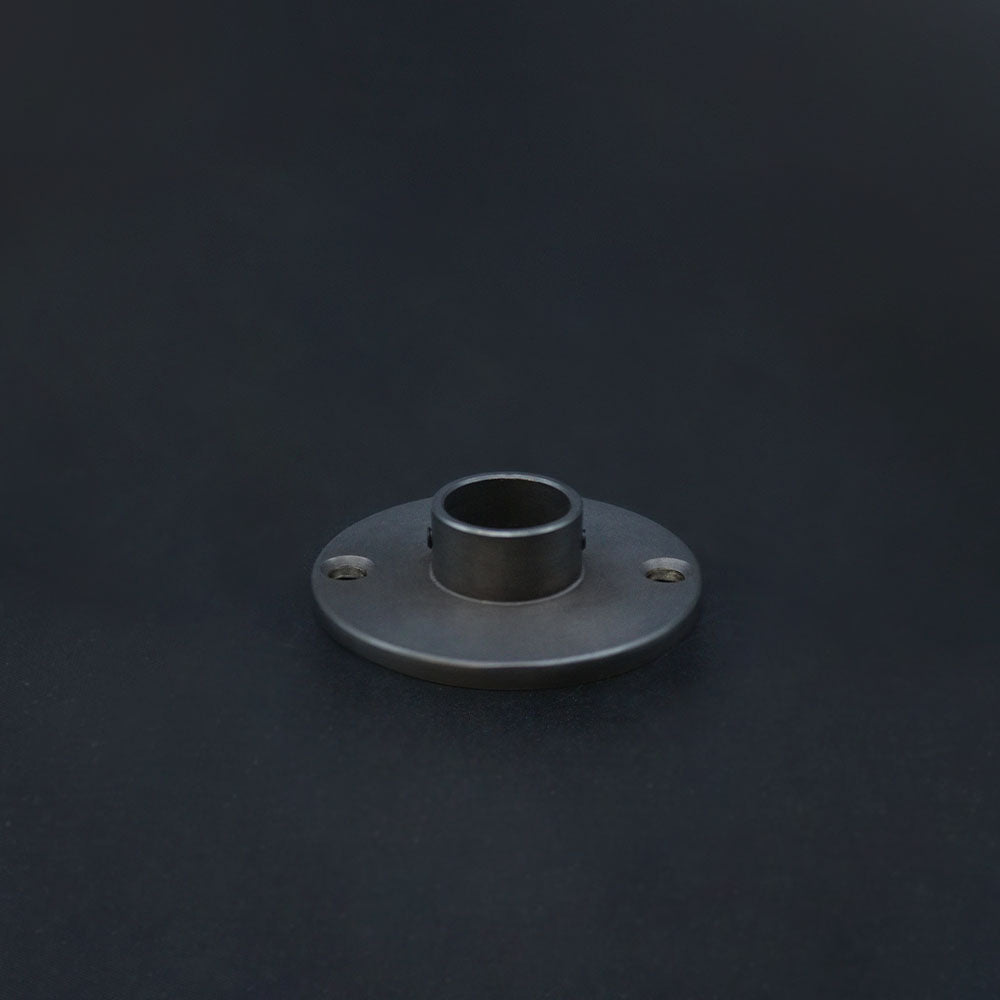A dark bronze conduit dome cover on a dark background.